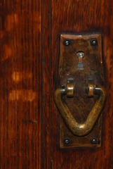Original patina to the Gustav Stickley hand hammered copper door pull hardware.